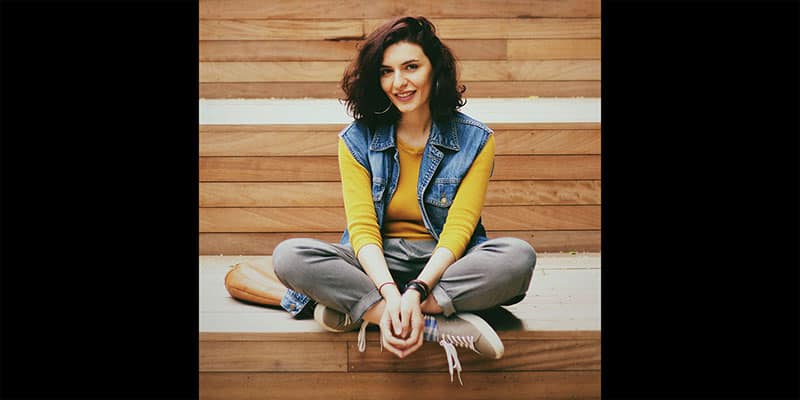 Portrait of attractive cheerful girl sitting lotus pose enjoying good mood  isolated over pink pastel color background Stock Photo - Alamy