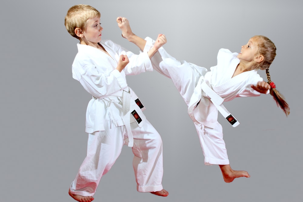 photo of children doing a karate pose