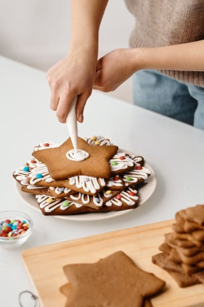 person decorating cake