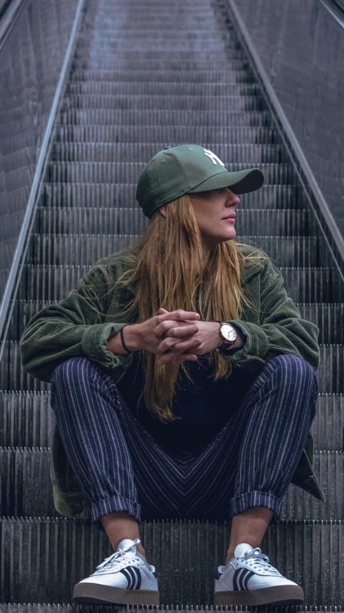 Girl Sitting On Escalator, female sitting Poses Reference