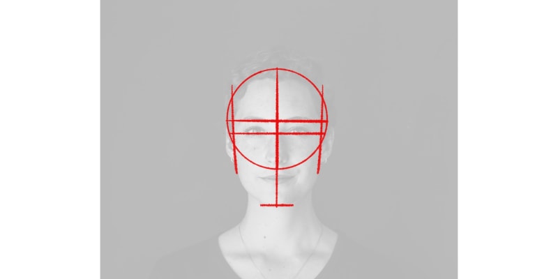 image of step 4 of drawing a basic head shape, with a line for the chin