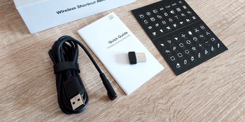 The USB-A To USB-C Cable, Quick Guide, Bluetooth Dongle And Sticker Sheet