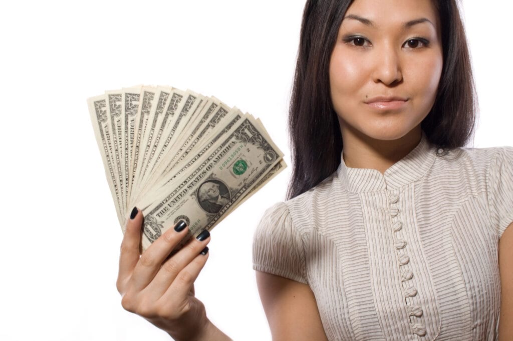 photo of woman holding a lot of money