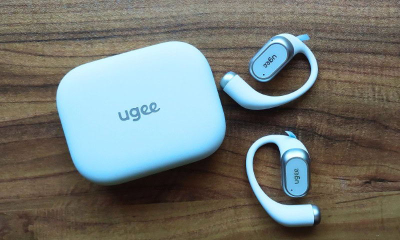 Ugee Fresound box with the earbuds next to them on a wooden surface. doncorgi.com